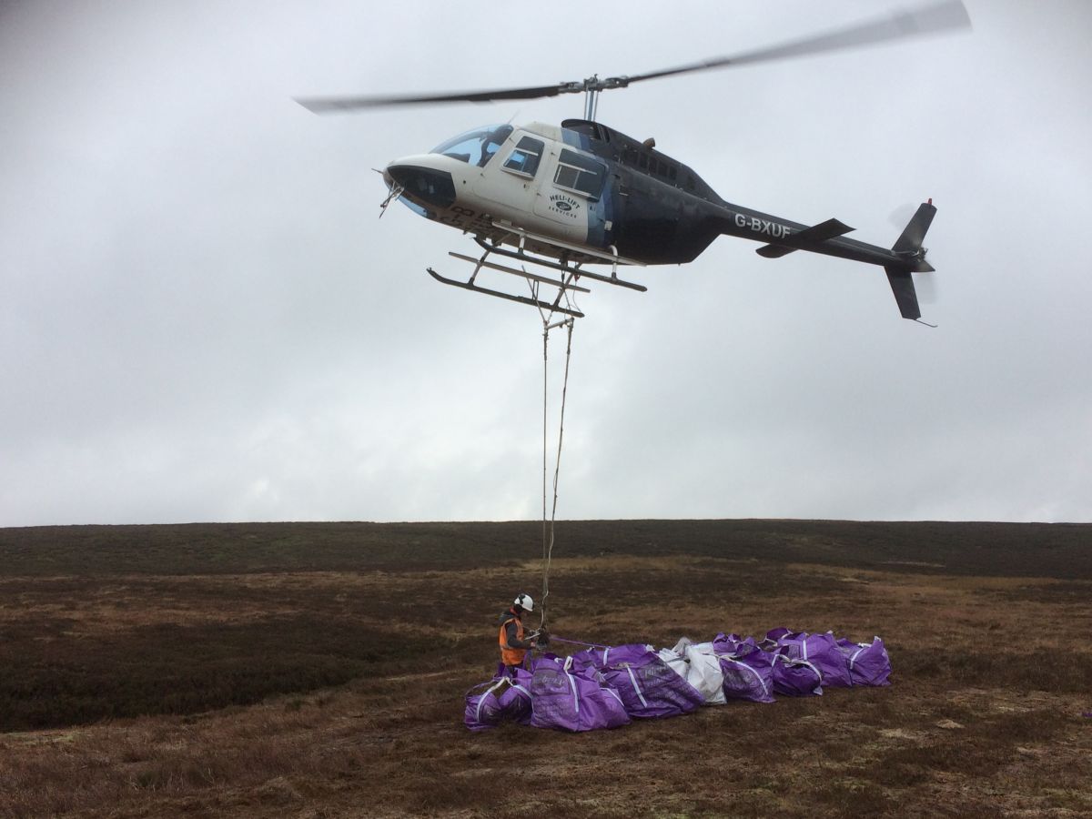 Helicopter lifting heather brash - Credit Yorkshire Water