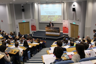 People watching a presentation in a lecture theatre