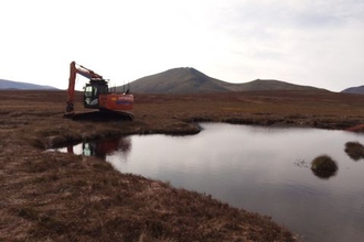 Machine operator restoring the peatlands at Abernethy.