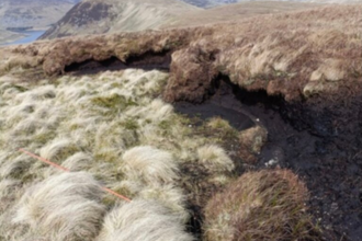 Image showing a bare peat hag on an upland peatland landscape.
