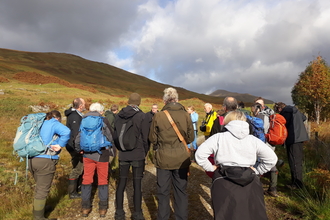 People standing on a peatland at the 2018 conference
