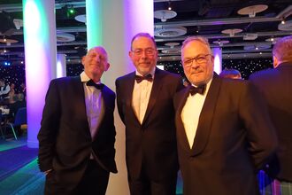 Rob Stoneman, Stuart Brooks and Clifton Bain in tuxedoes.