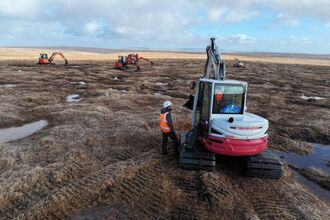 SWPP Project officer chatting with contractors working to raise and stabilize the water table in the peat out at Tavy Head Dartmoor credit Quantock and Exmoor Ltd.