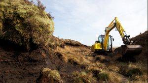 Digger being used to carry out peat bog restoration. Photo: Montgomeryshire Wildlife Trust