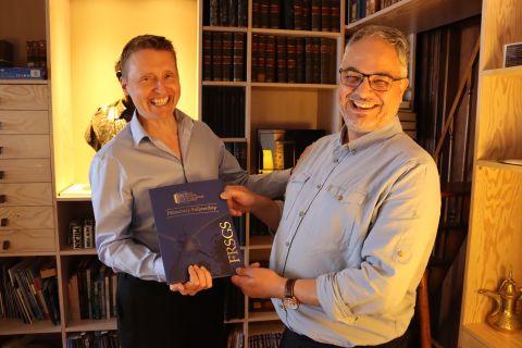 Programme Adviser Clifton Bain being awarded a Royal Scottish Geographical Society (RSGS) Honorary Fellowship by RSGS CEO Mike Robinson.