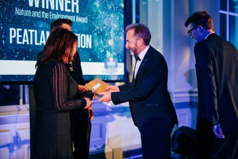 Peter Hutchinson, NatureScot Peatland ACTION Programme Strategy Manager, and Barry Dunne, NatureScot Peatland ACTION Operations Manager, receiving the Holyrood Climate Action Award for Nature and the Environment at the awards ceremony in Edinburgh © Andrew Perry