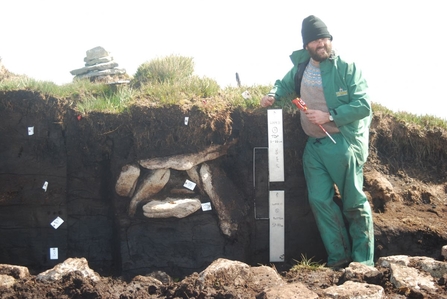 Professor Andy Jones (Cornwall Archaeological Unit) next to the Whitehorse Hill cist prior to detailed excavation in 2011.