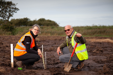 Andrea Kelly (Broads Authority, Environment and Policy Adviser) planting at Horsey wet farm.