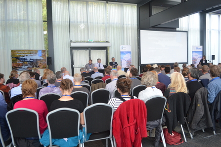 People listening to a talk at the 2018 conference