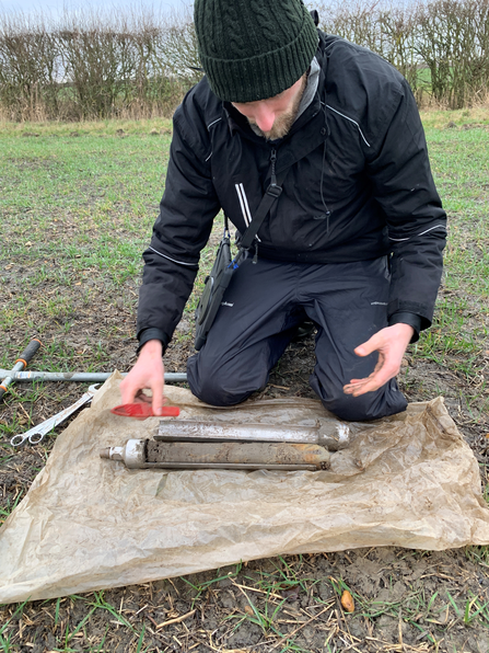 Natural England: man looking at soil core